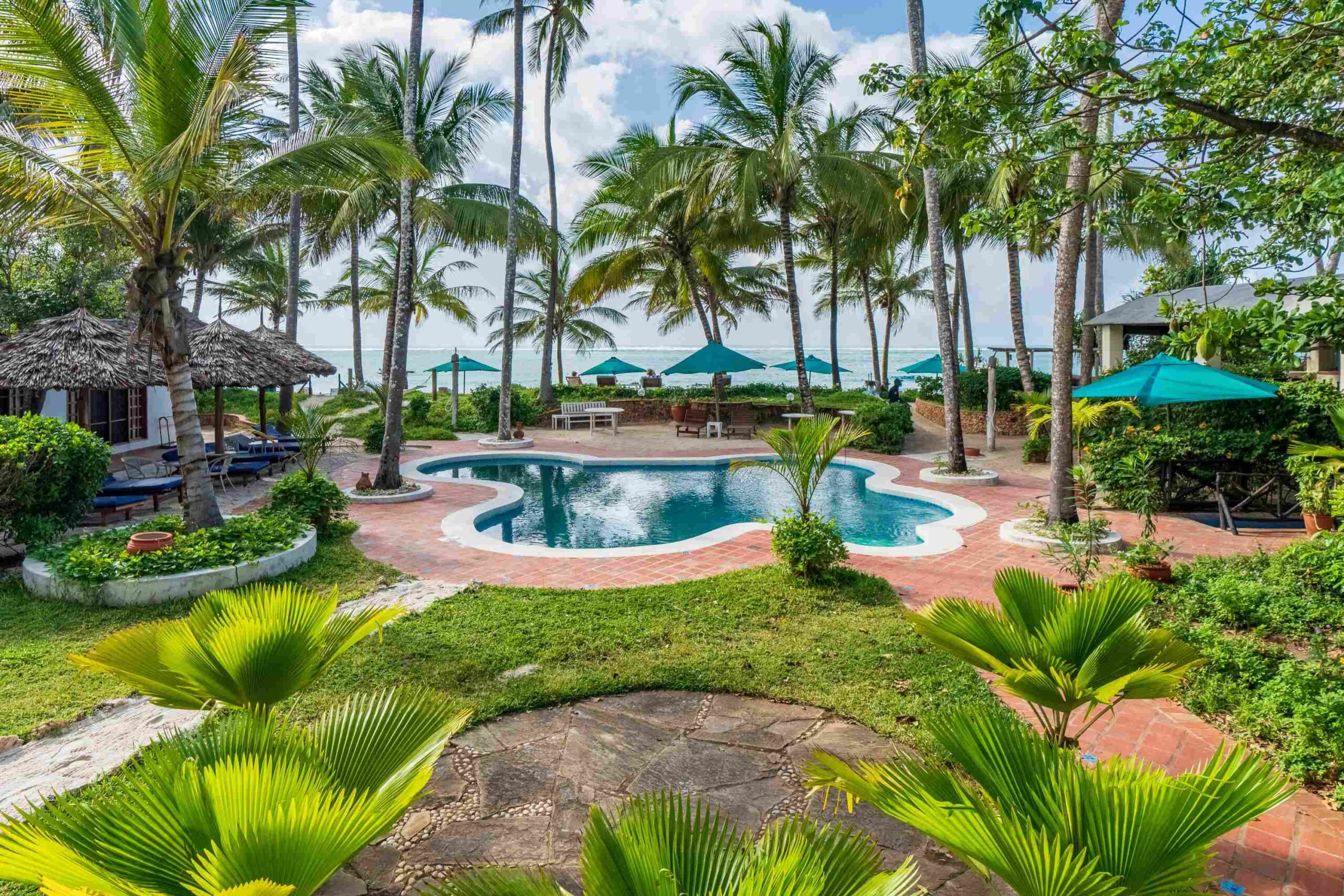 Luxury room with Swahili decor and pool access at Asha Boutique Hotel